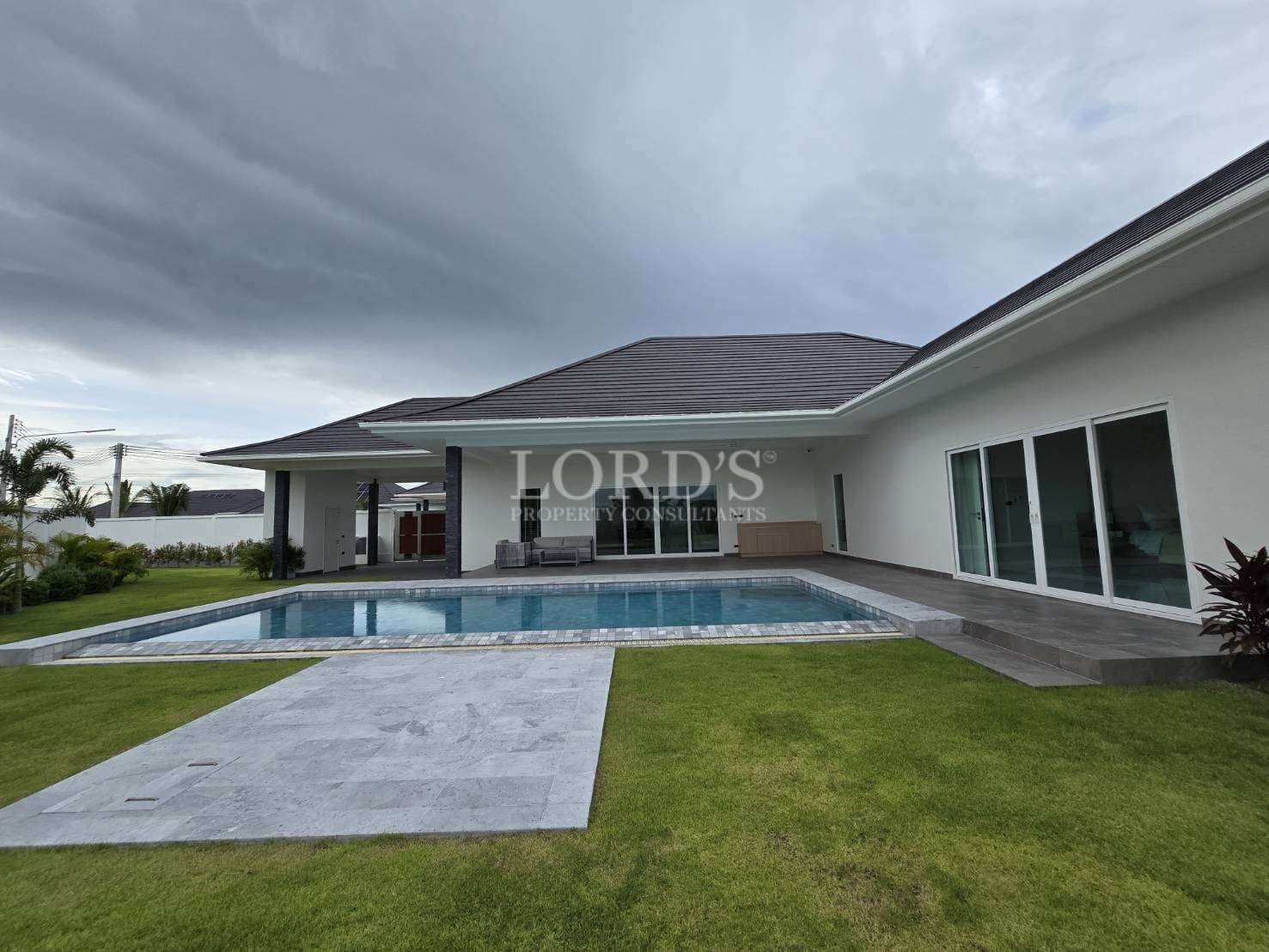 Modern house with pool and lawn