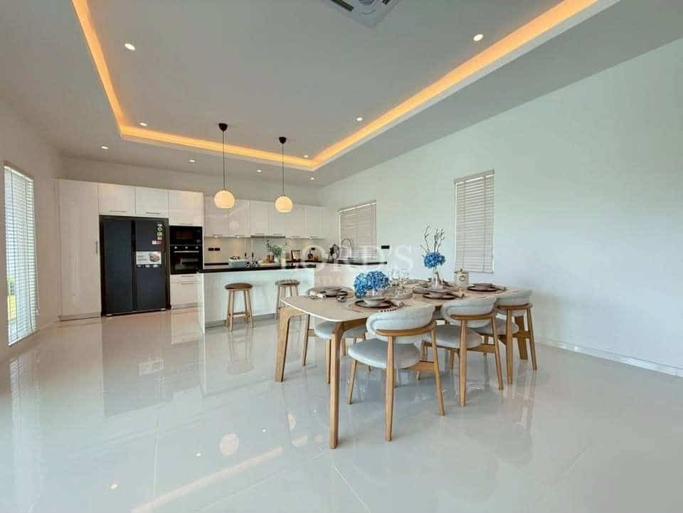 Modern kitchen with dining area.